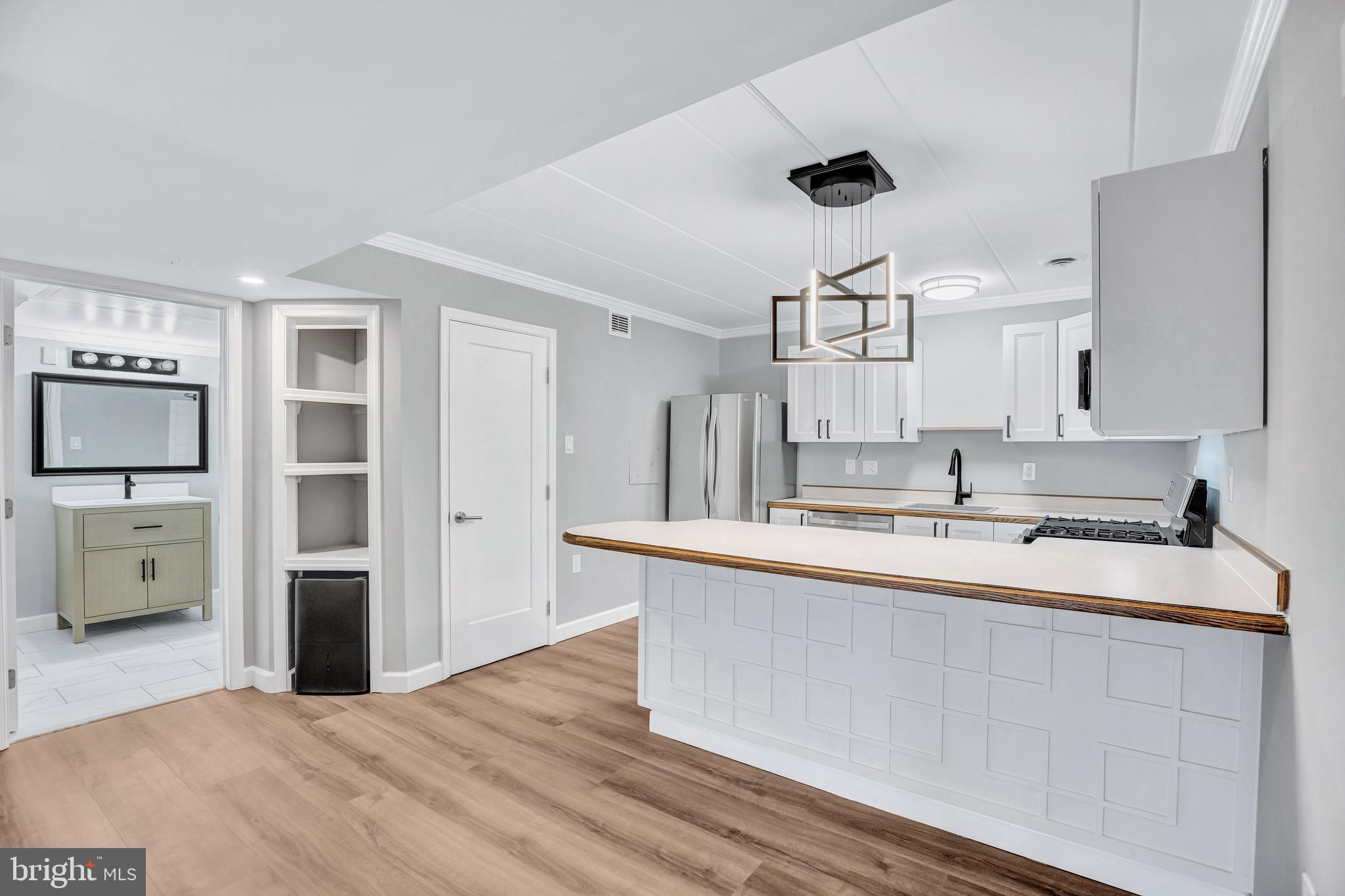 2605 Fort Farnsworth Road, Unit 314 Alexandria, VA 22303 - Photo 8 of 34 a kitchen with a sink a refrigerator and cabinets