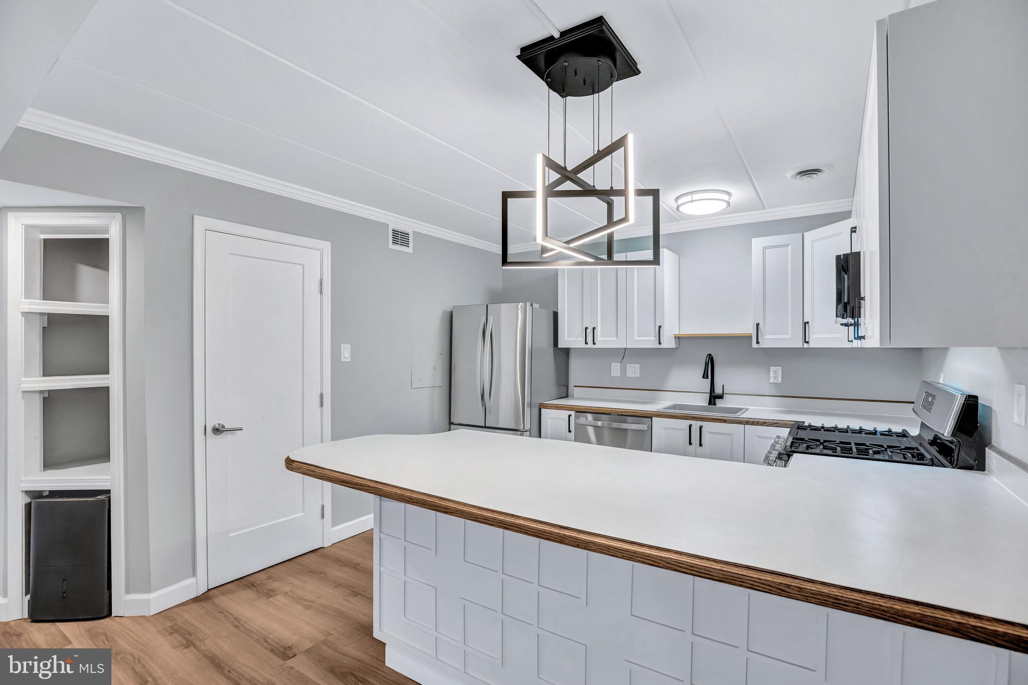 2605 Fort Farnsworth Road, Unit 314 Alexandria, VA 22303 - Photo 9 of 34 a kitchen with stainless steel appliances a sink and stove