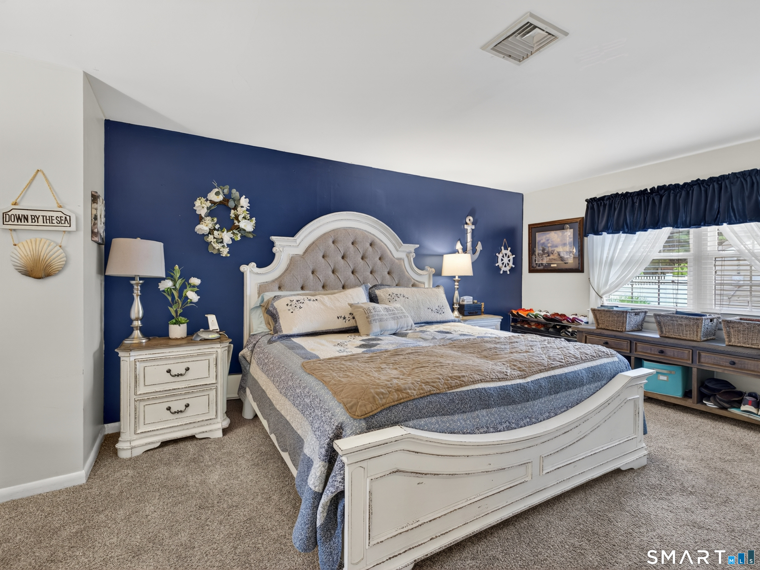 235 Scotland Road Norwich, CT 06360 - Photo 16 of 31 a spacious bedroom with a bed a dresser and mirror