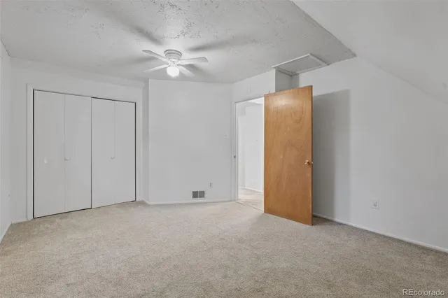 an empty room with fireplace