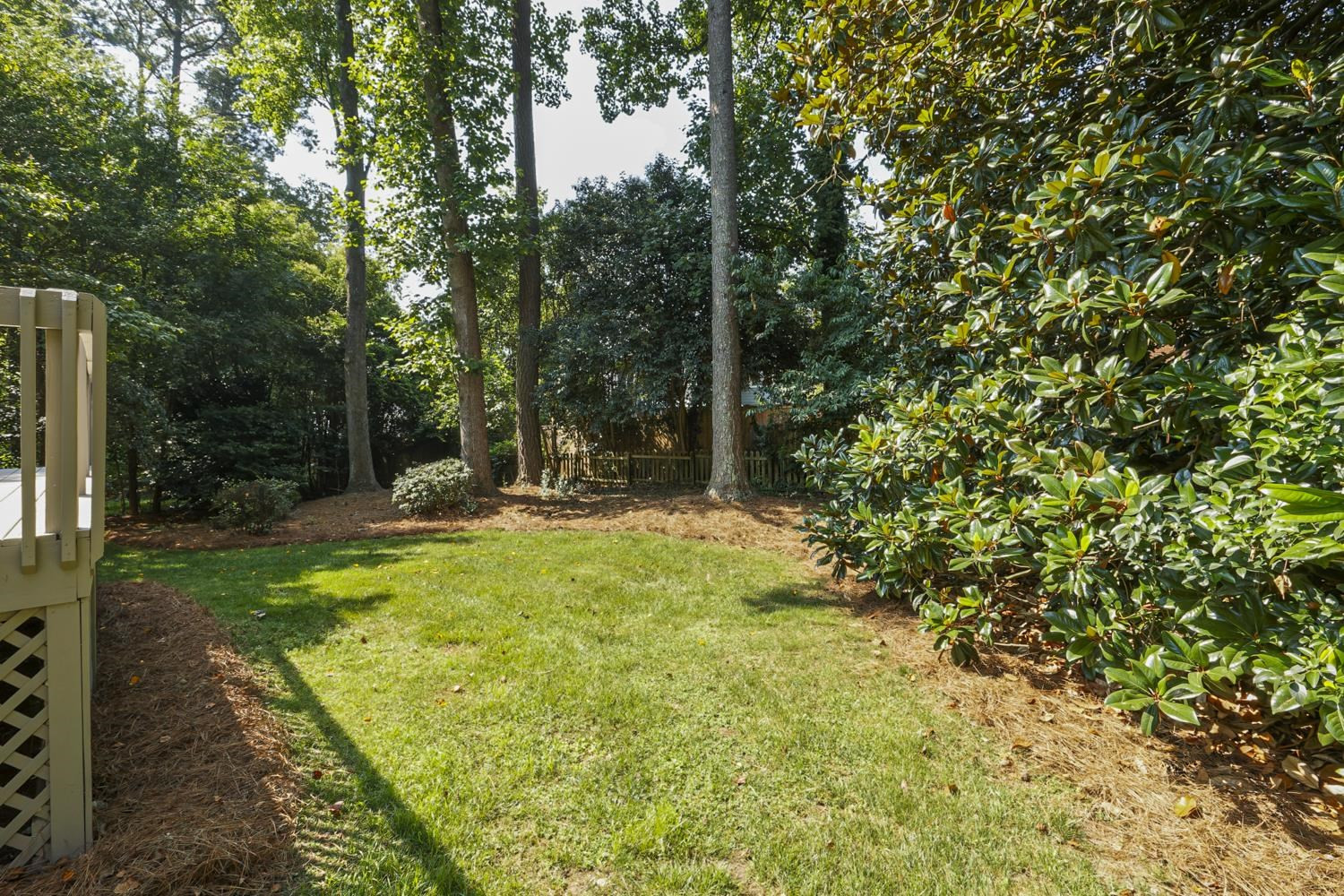 708 Dartmouth Road Raleigh, NC 27609 - Photo 14 of 15 Enjoy the beauty of the lush landscaping when outdoors relaxing on the deck or entertaining family and friends. Backyard