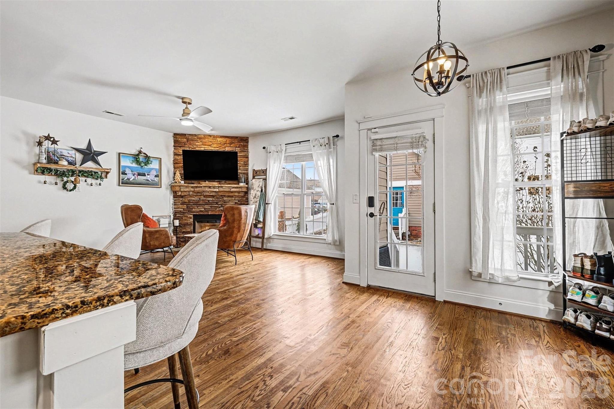 191 Lilac Mist Loop Mooresville, NC 28115 - Photo 12 of 44 a living room with fireplace furniture and a flat screen tv