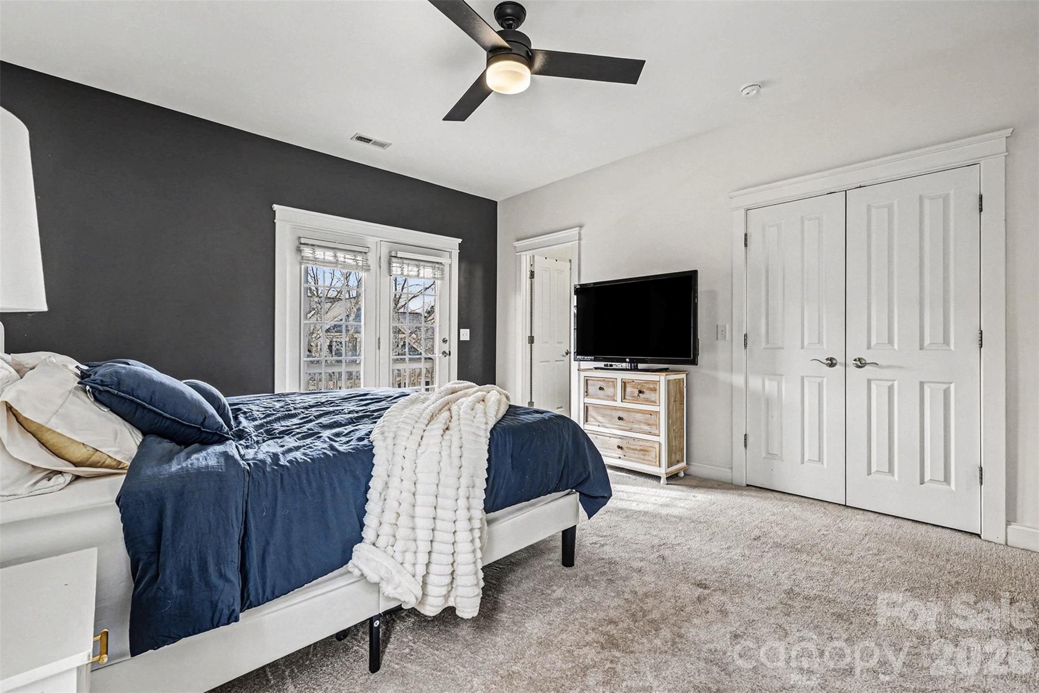 191 Lilac Mist Loop Mooresville, NC 28115 - Photo 18 of 44 a bedroom with a bed tv and a window