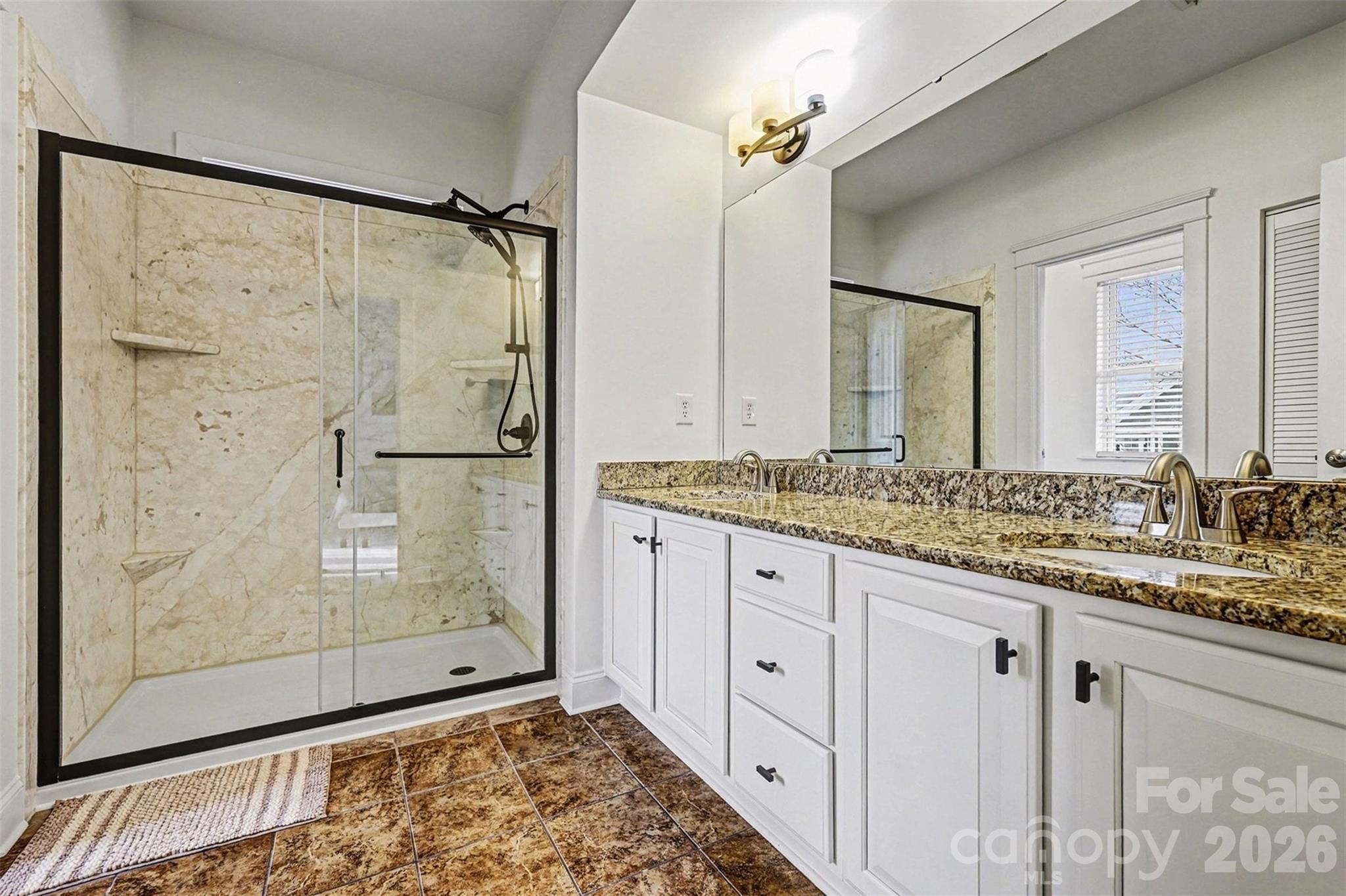 191 Lilac Mist Loop Mooresville, NC 28115 - Photo 22 of 44 a bathroom with a granite countertop sink and a mirror