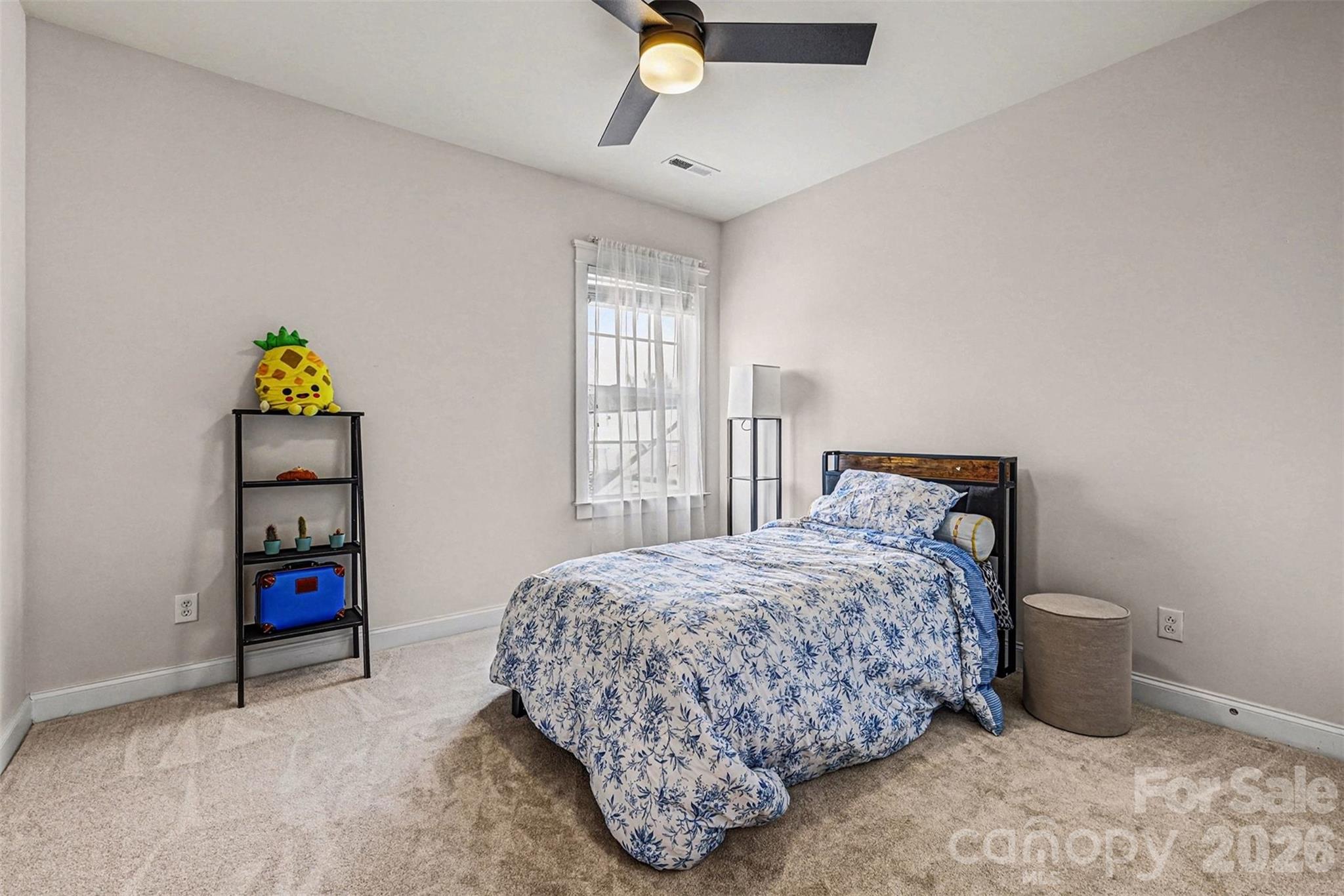 191 Lilac Mist Loop Mooresville, NC 28115 - Photo 24 of 44 a bedroom with a bed and a window