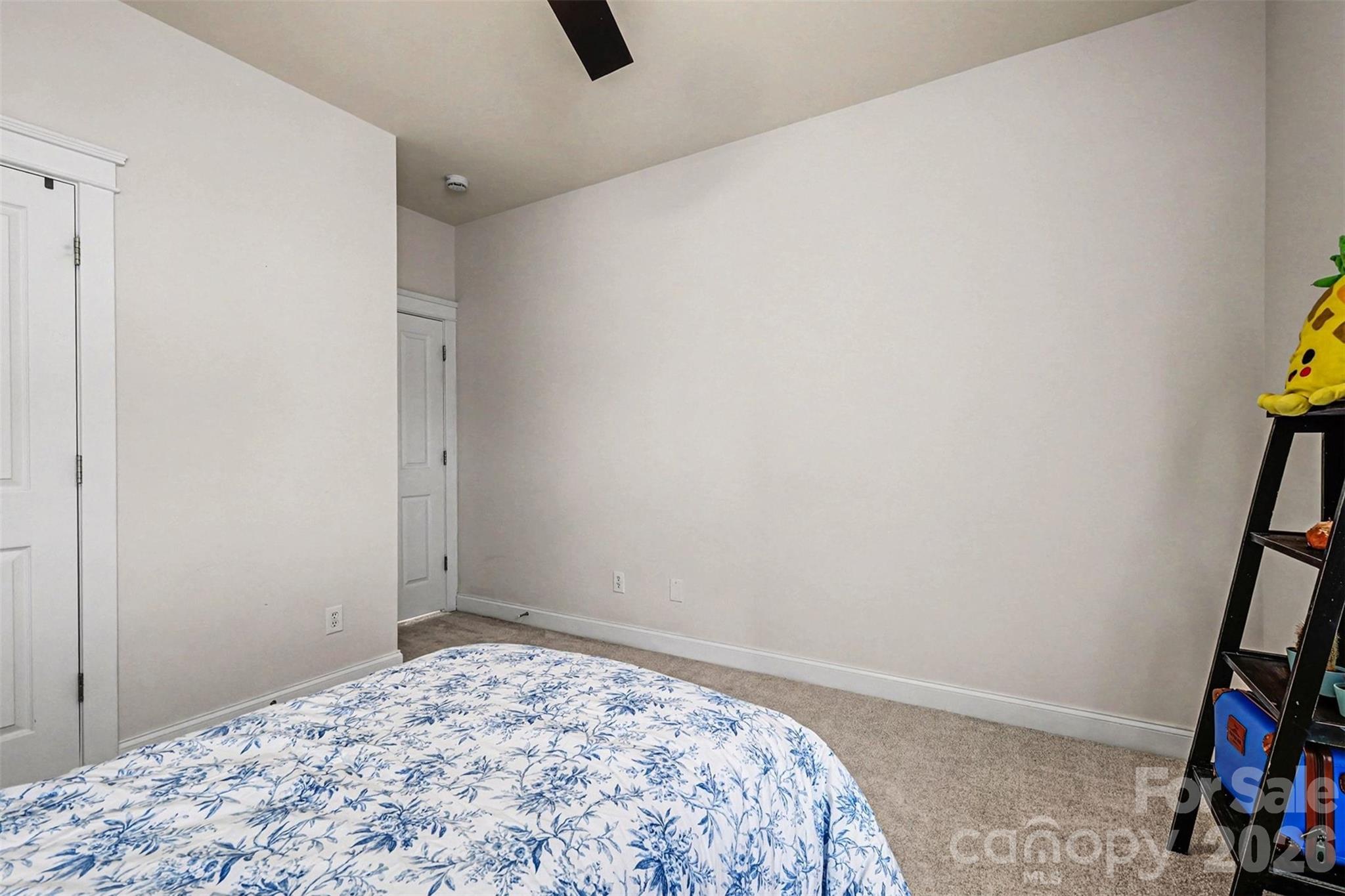 191 Lilac Mist Loop Mooresville, NC 28115 - Photo 25 of 44 a bedroom with a bed and a window