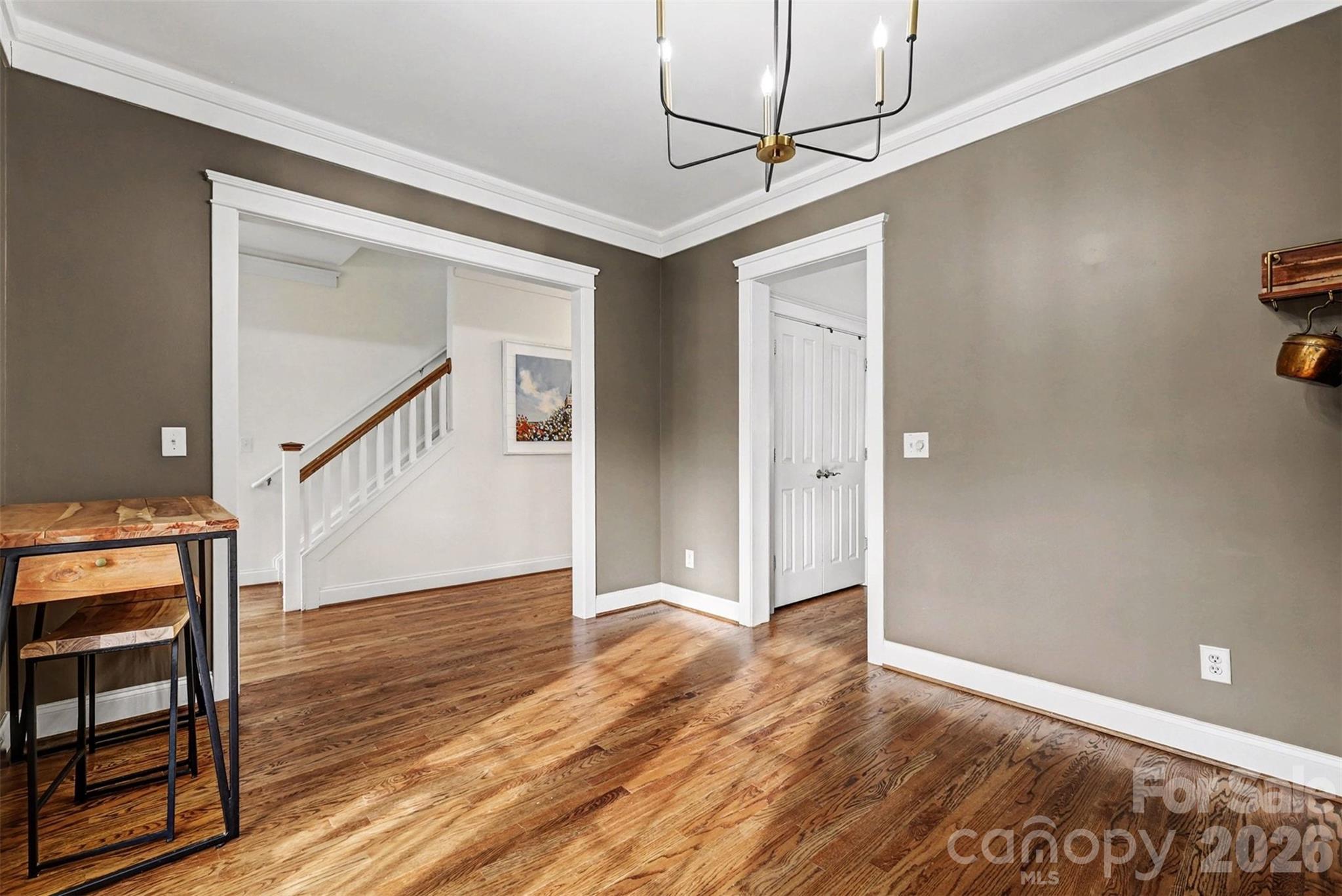 191 Lilac Mist Loop Mooresville, NC 28115 - Photo 8 of 44 a view of a hallway with wooden floor and staircase