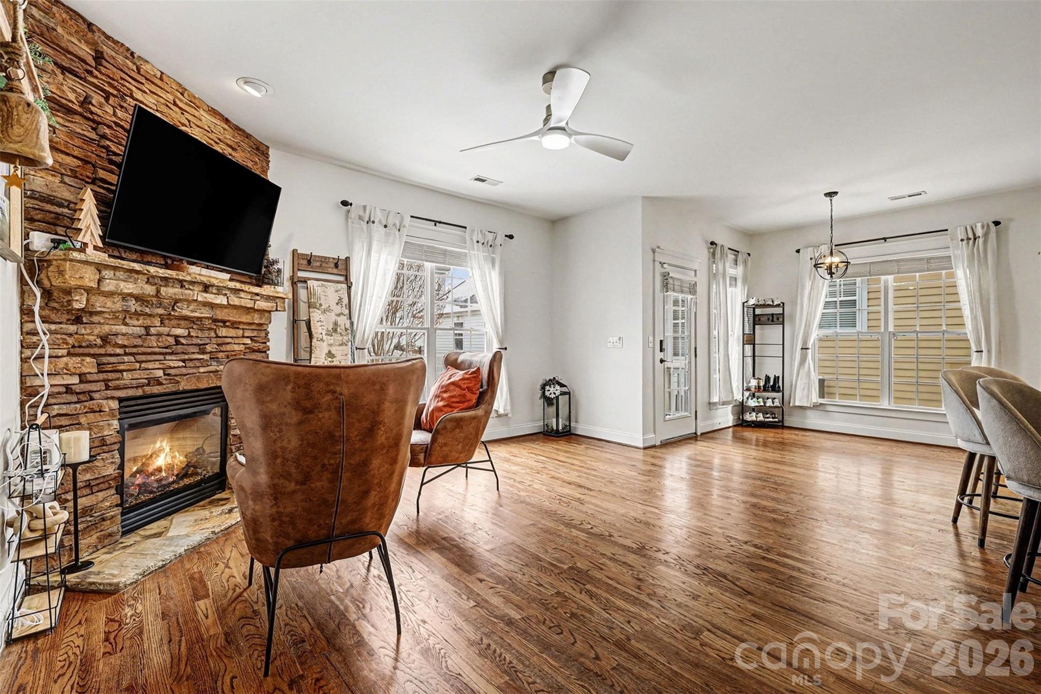 191 Lilac Mist Loop Mooresville, NC 28115 - Photo 10 of 44 a view of a livingroom with furniture and a flat screen tv