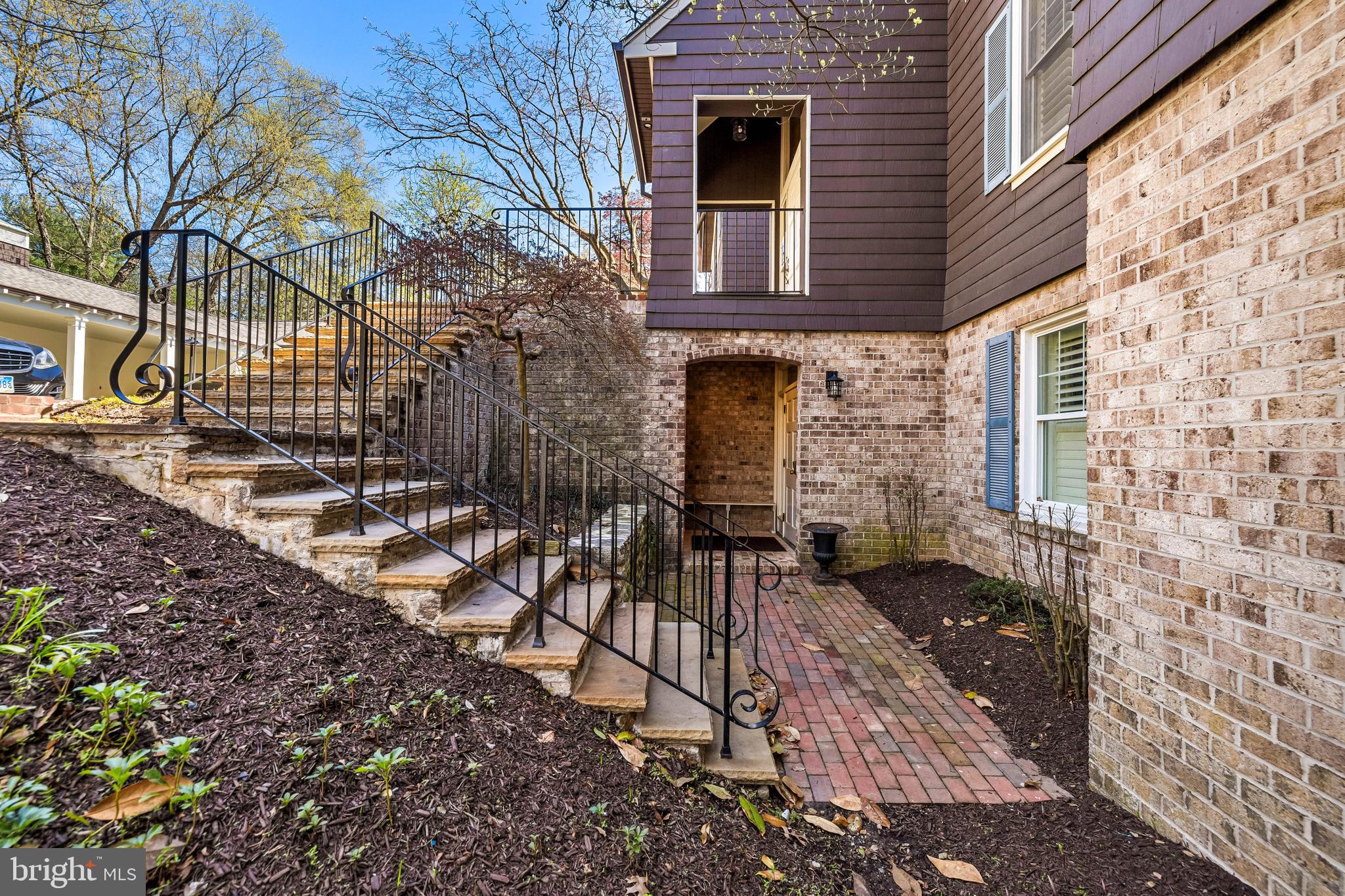 7 Devon Hill Road, Unit A4 Baltimore, MD 21210 - Photo 2 of 30 a view of a brick house with a yard