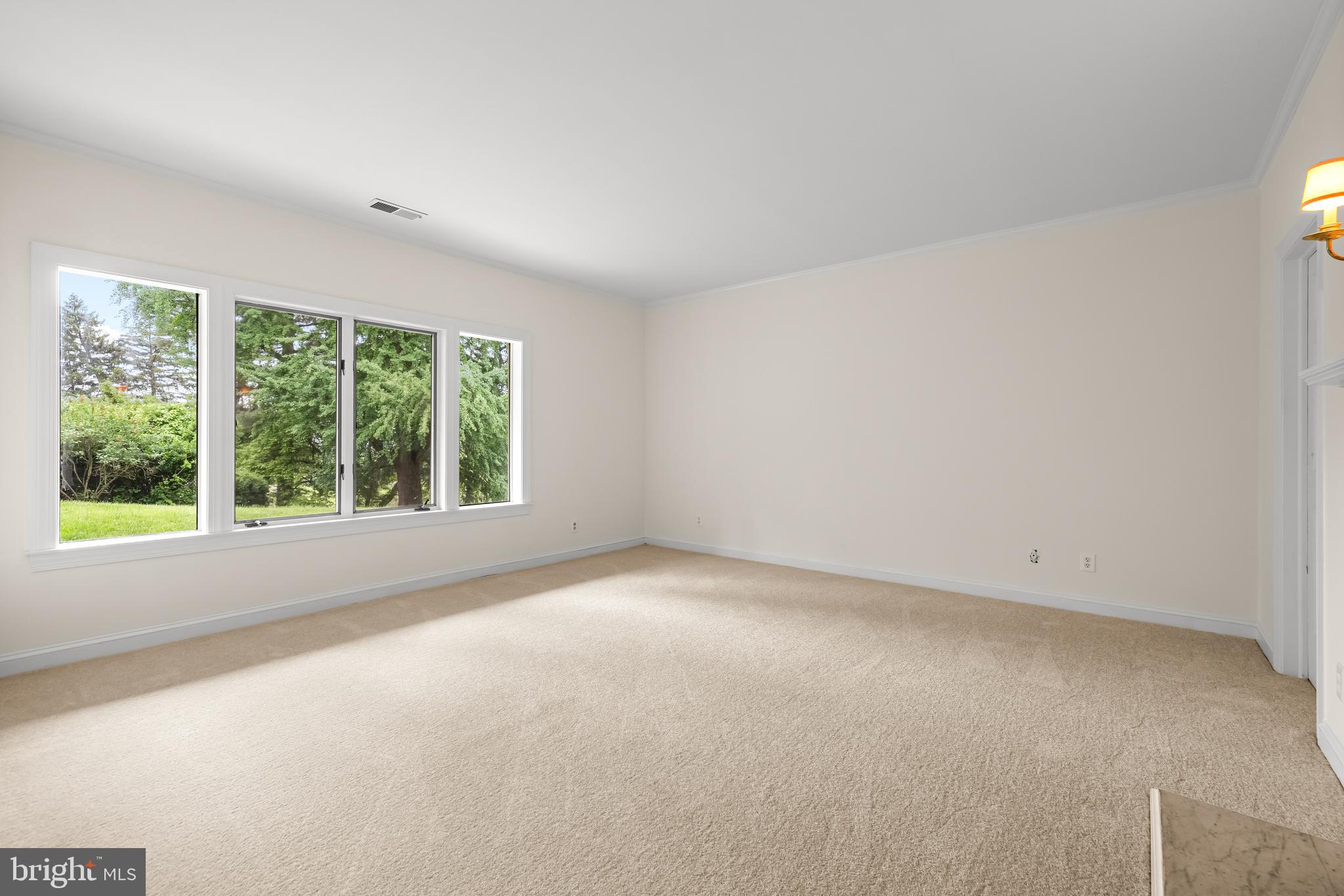 7 Devon Hill Road, Unit A4 Baltimore, MD 21210 - Photo 25 of 30 an empty room with large windows