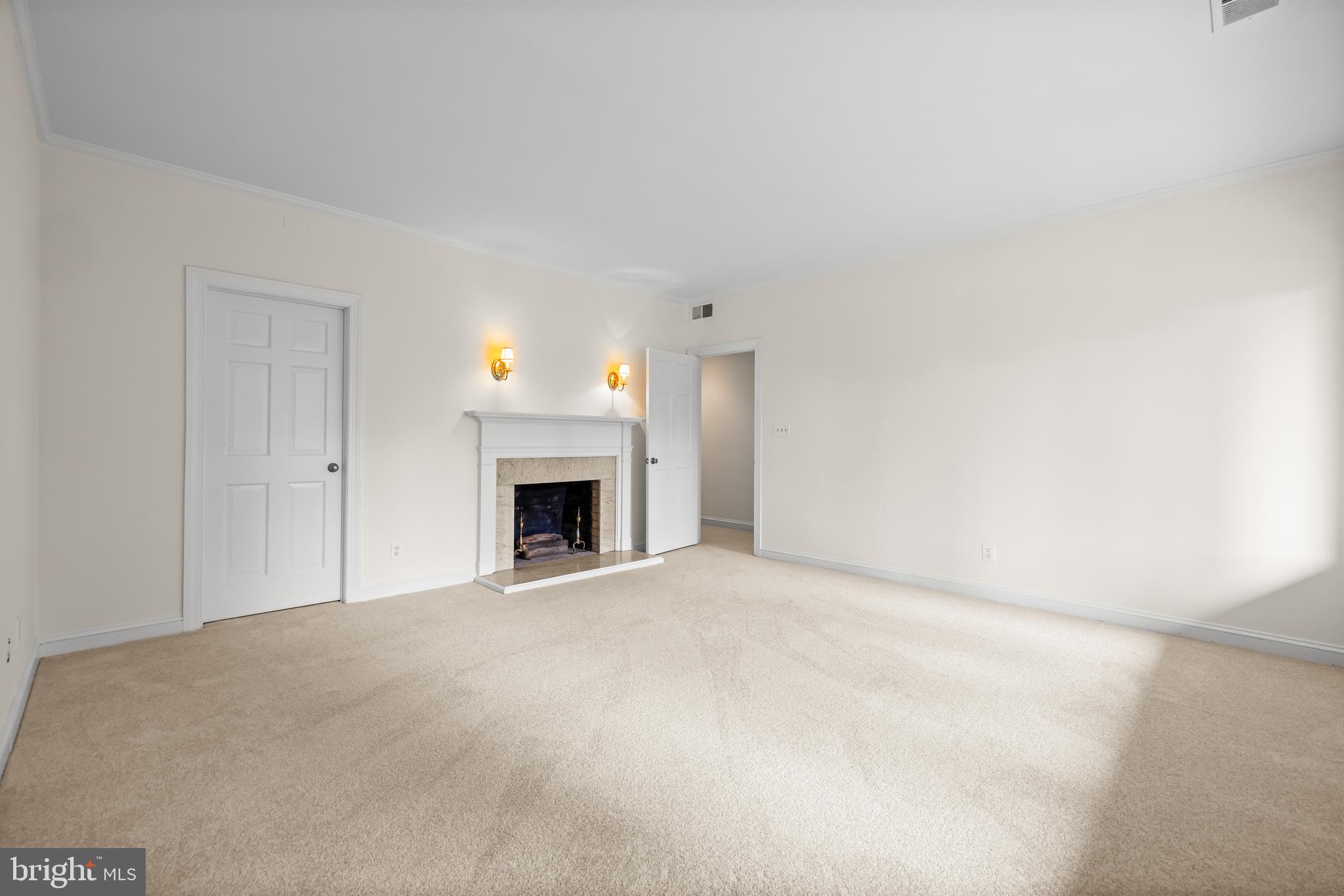 7 Devon Hill Road, Unit A4 Baltimore, MD 21210 - Photo 26 of 30 a view of an empty room with a fireplace