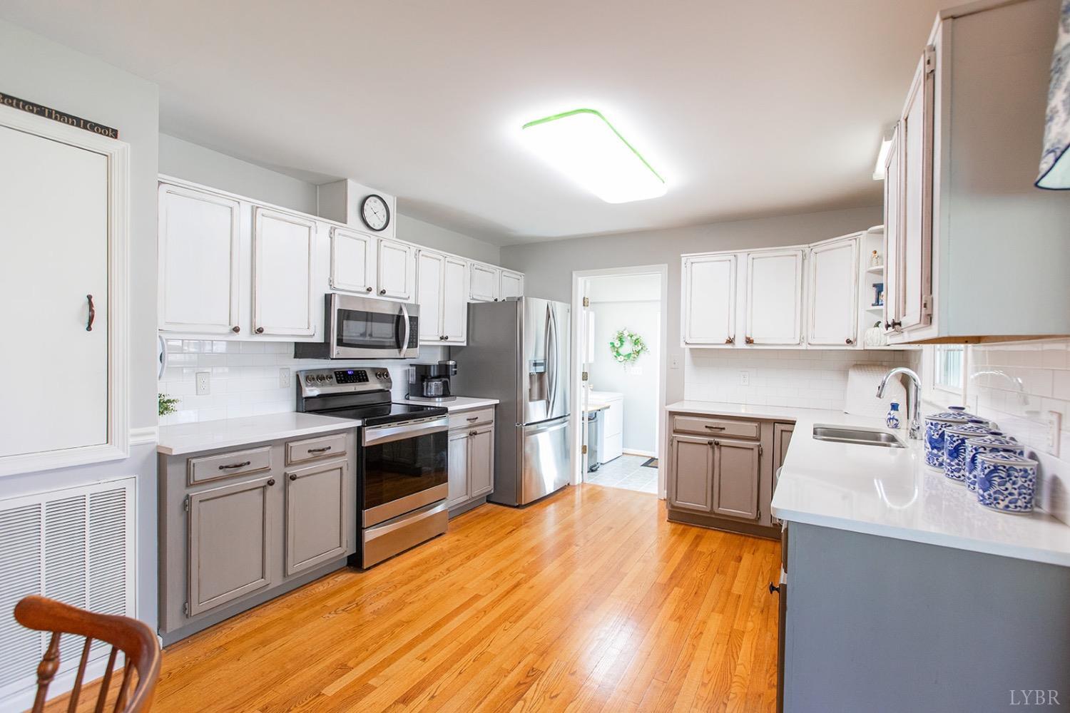 115 Hunters Creek Road Forest, VA 24551 - Photo 15 of 43 a kitchen with granite countertop a sink cabinets stainless steel appliances and a counter space