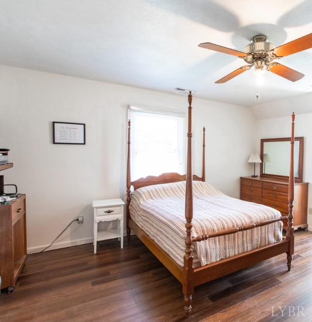 115 Hunters Creek Road Forest, VA 24551 - Photo 25 of 43 a bedroom with a bed and a ceiling fan
