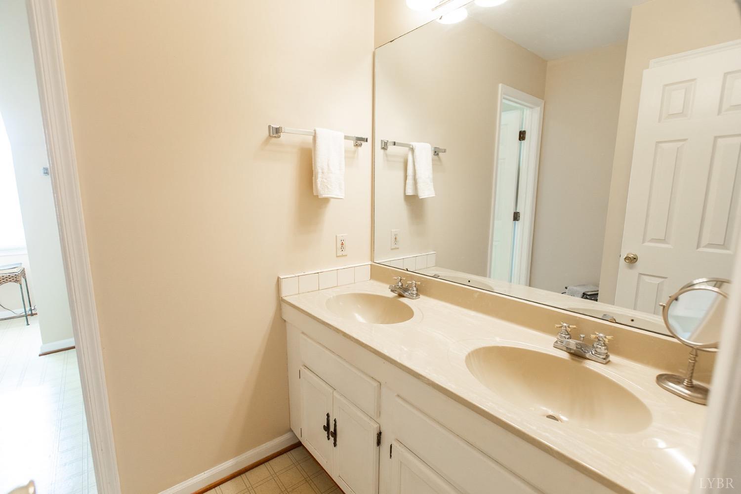 115 Hunters Creek Road Forest, VA 24551 - Photo 26 of 43 a bathroom with a sink and a mirror