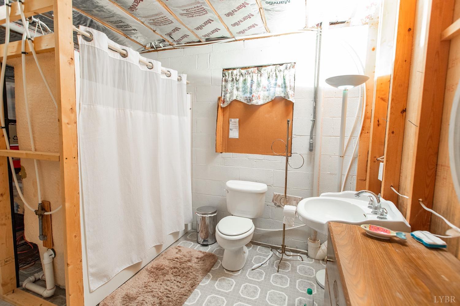 115 Hunters Creek Road Forest, VA 24551 - Photo 35 of 43 a bathroom with a sink toilet and shower