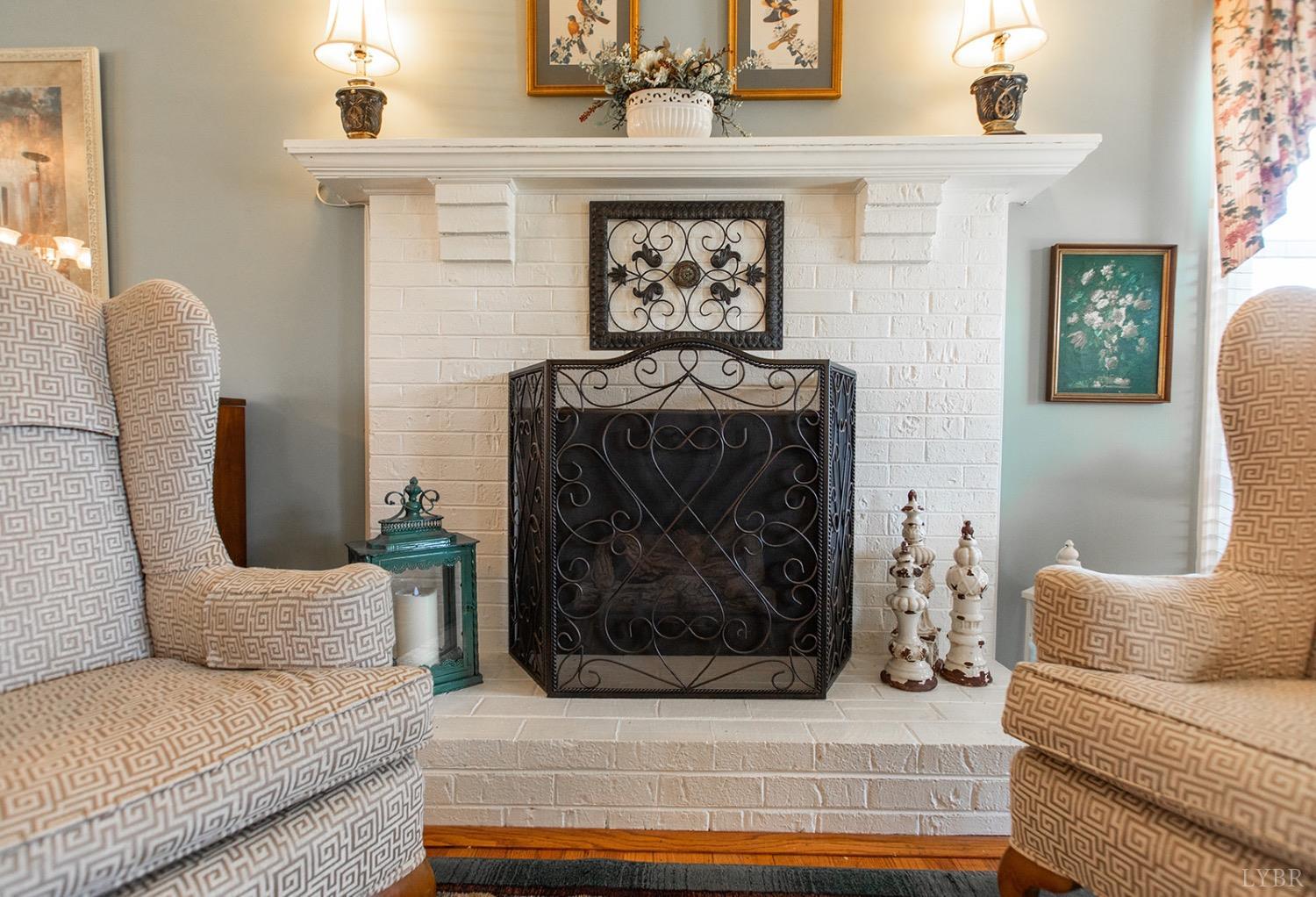 115 Hunters Creek Road Forest, VA 24551 - Photo 9 of 43 a living room with furniture and a fireplace