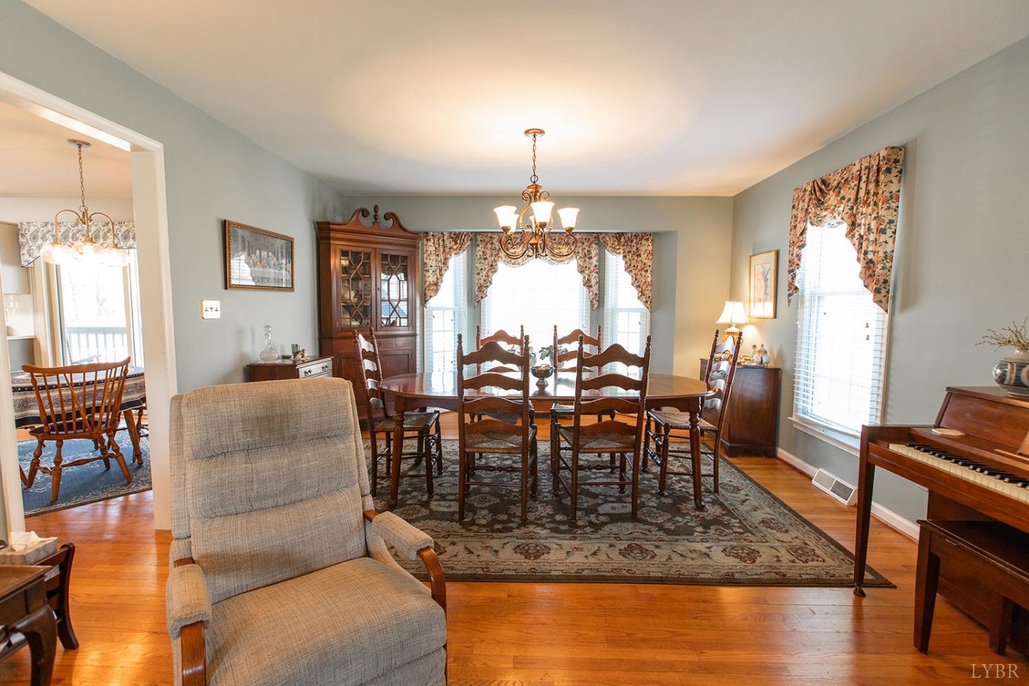 115 Hunters Creek Road Forest, VA 24551 - Photo 10 of 43 a view of a dining room with furniture window and wooden floor