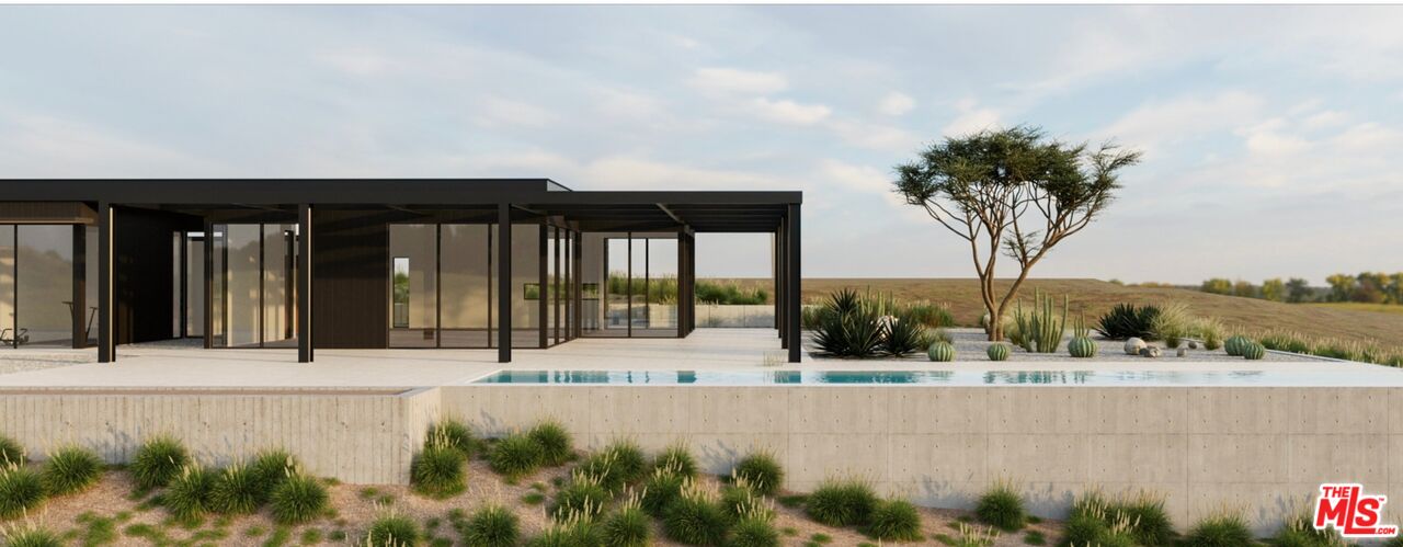 a view of swimming pool in front of a yard