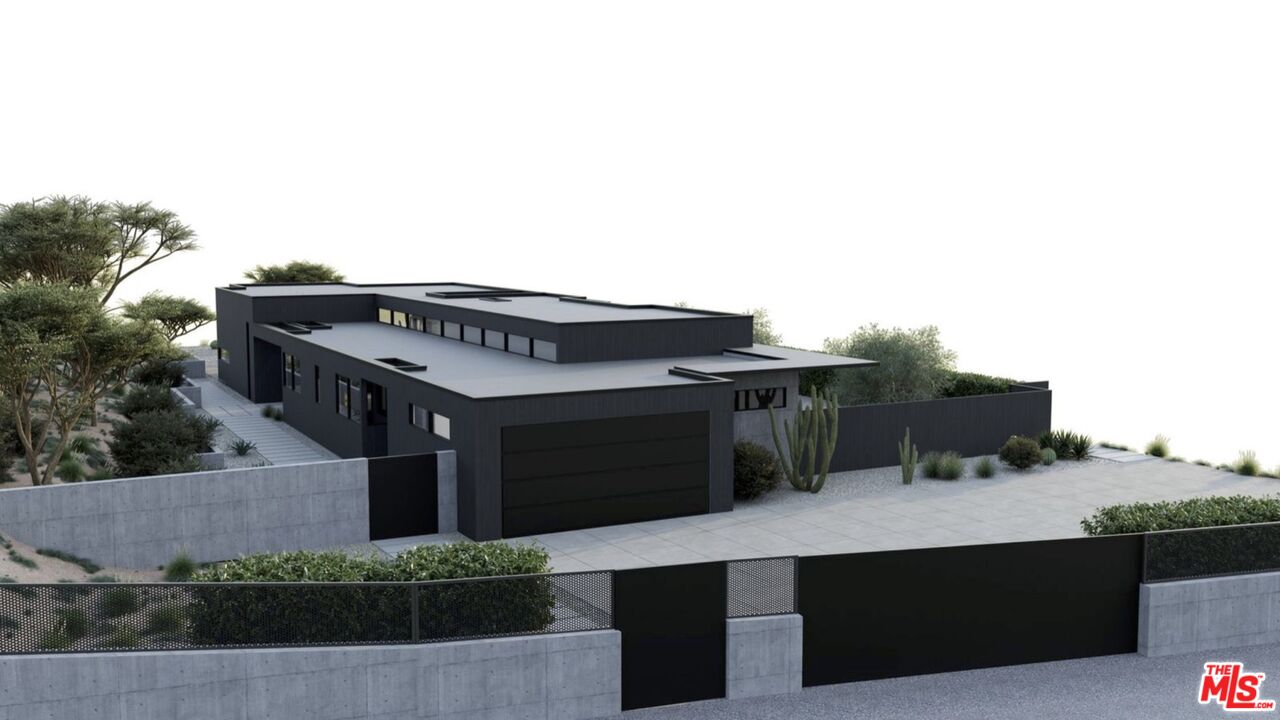 6658 Wandermere Road Malibu, CA 90265 - Photo 3 of 21 a front view of a house with a yard