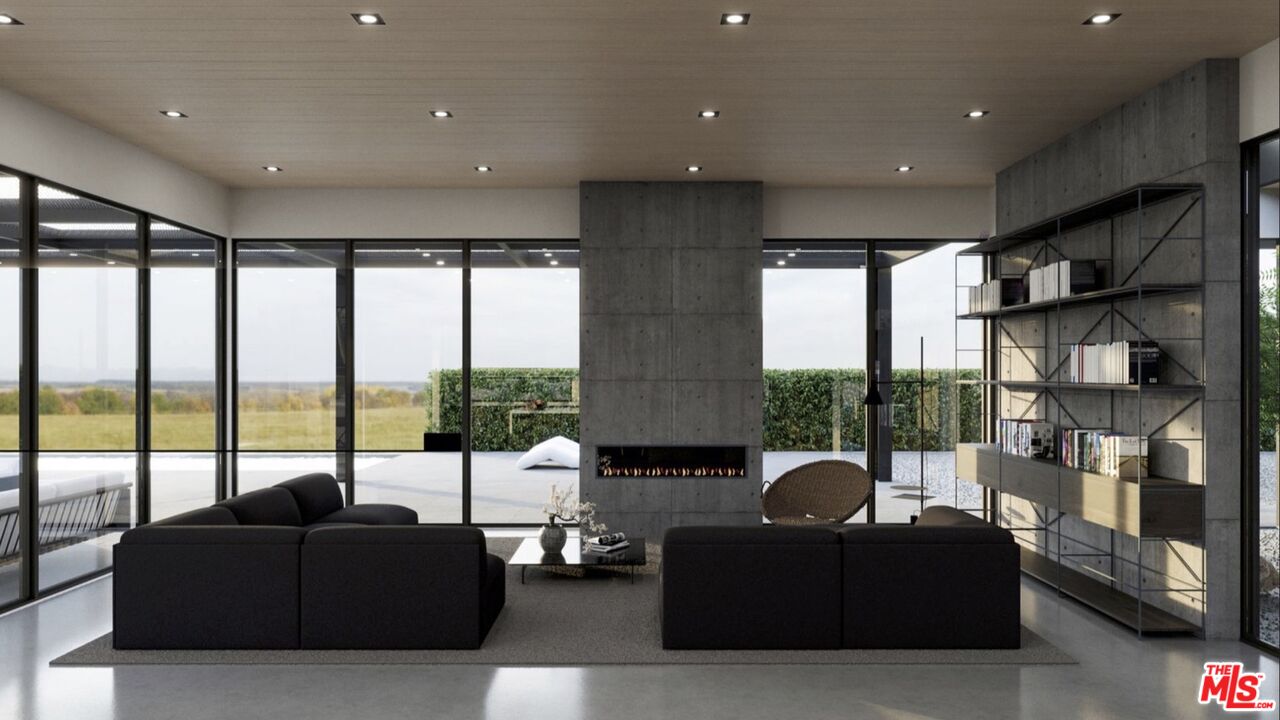 6658 Wandermere Road Malibu, CA 90265 - Photo 8 of 21 a living room with furniture and a floor to ceiling window