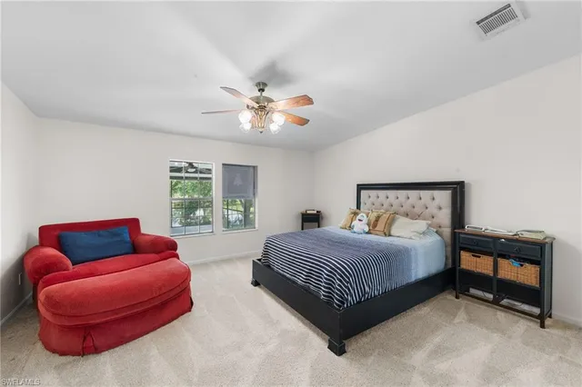 a bedroom with a bed and a couch