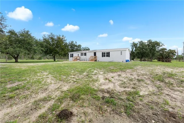 a view of a yard with an outdoor space