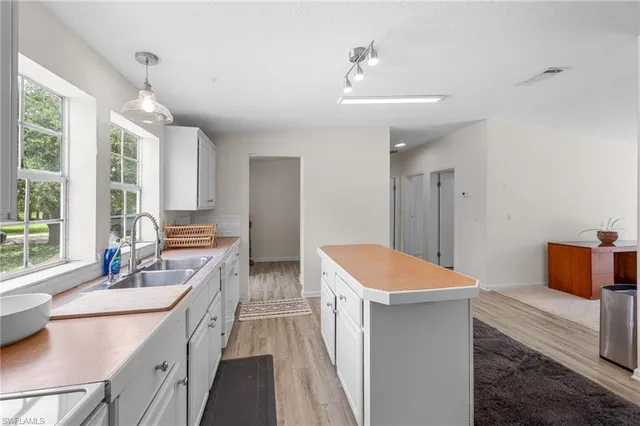 a bathroom with a sink double vanity and a tub