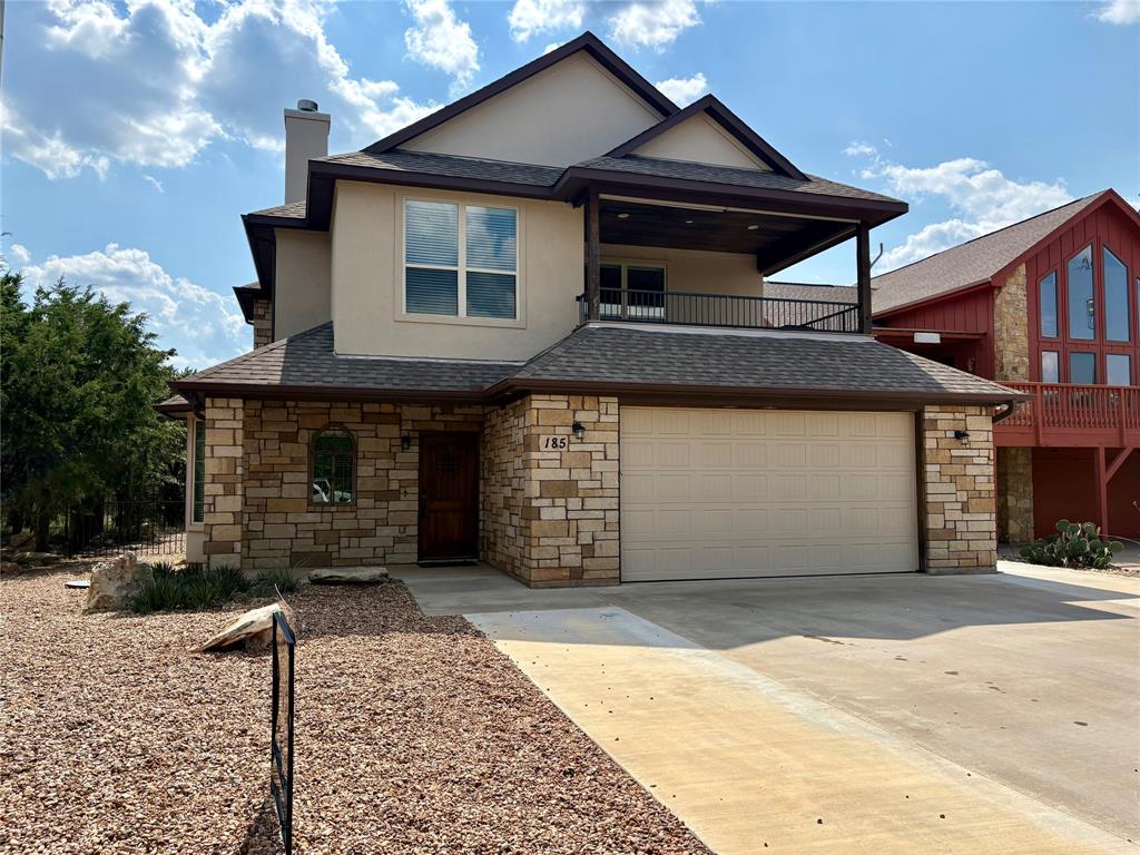 a front view of a house with a garage