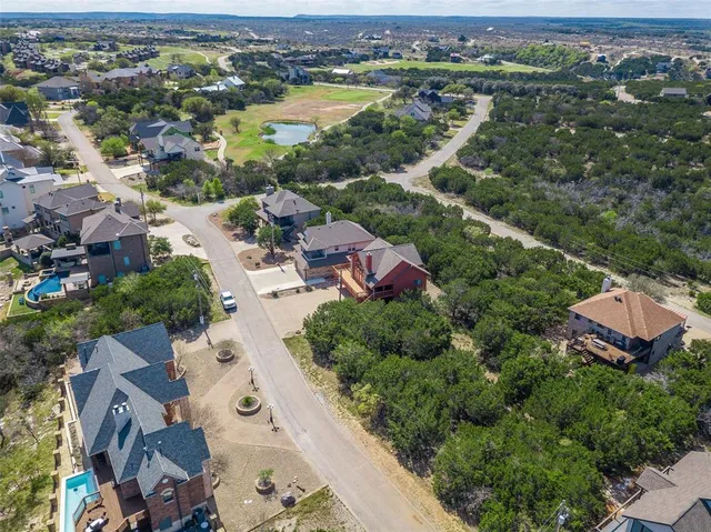 an aerial view of a city with mountains