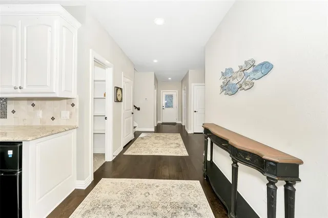 a view of bedroom with furniture and wooden floor