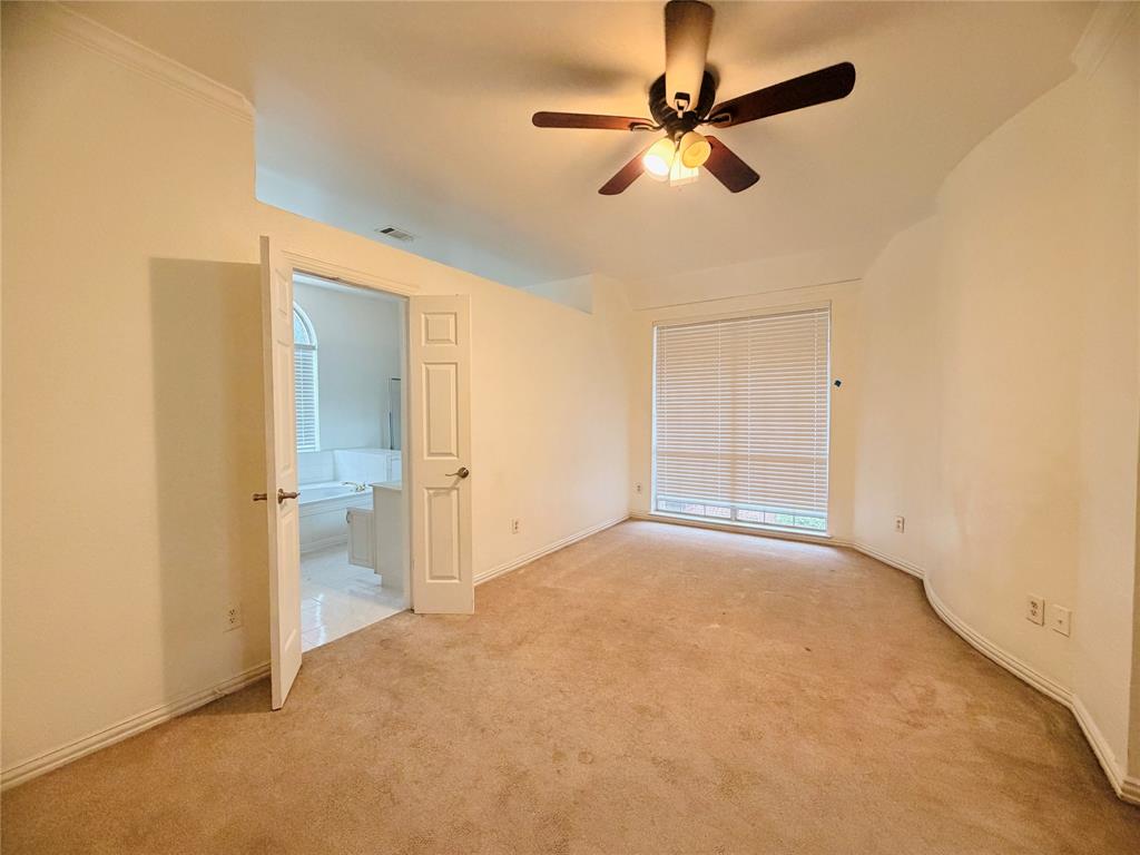 434 Moonlight Way Irving, TX 75063 - Photo 15 of 29 an empty room with fan and windows