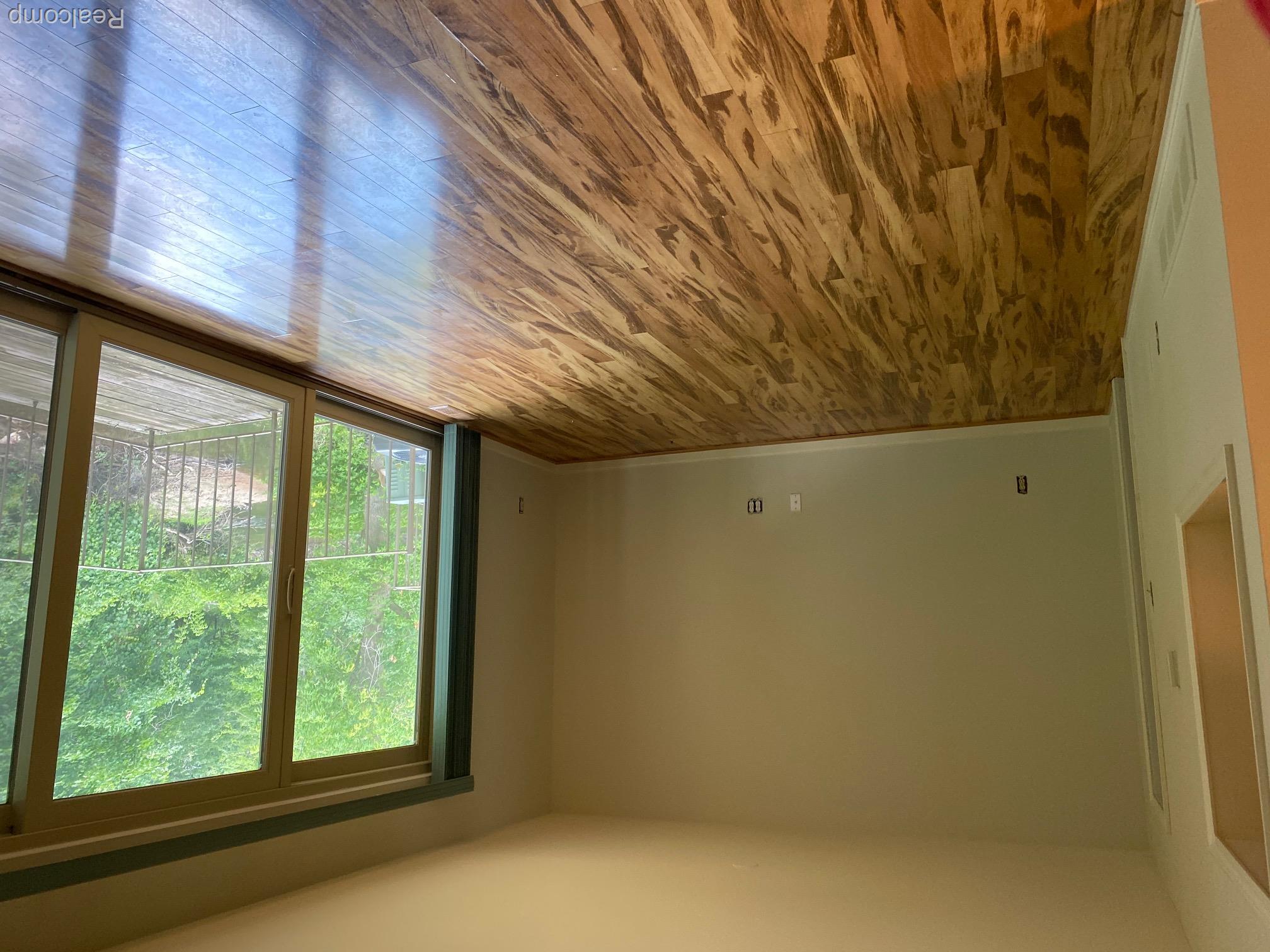 629 Oakbrook West, Unit 18 Rochester, MI 48307 - Photo 4 of 18 Wood-finish flooring in both the living rm. and dining rm. with sliding glass doors leading to a
private outdoor deck with metal railings