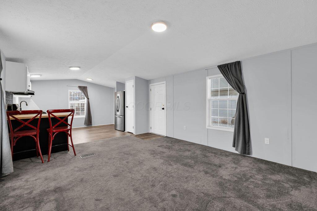 8764 National Road Southwest, Unit 106 Etna, OH 43062 - Photo 7 of 28 Living Room and Kitchen