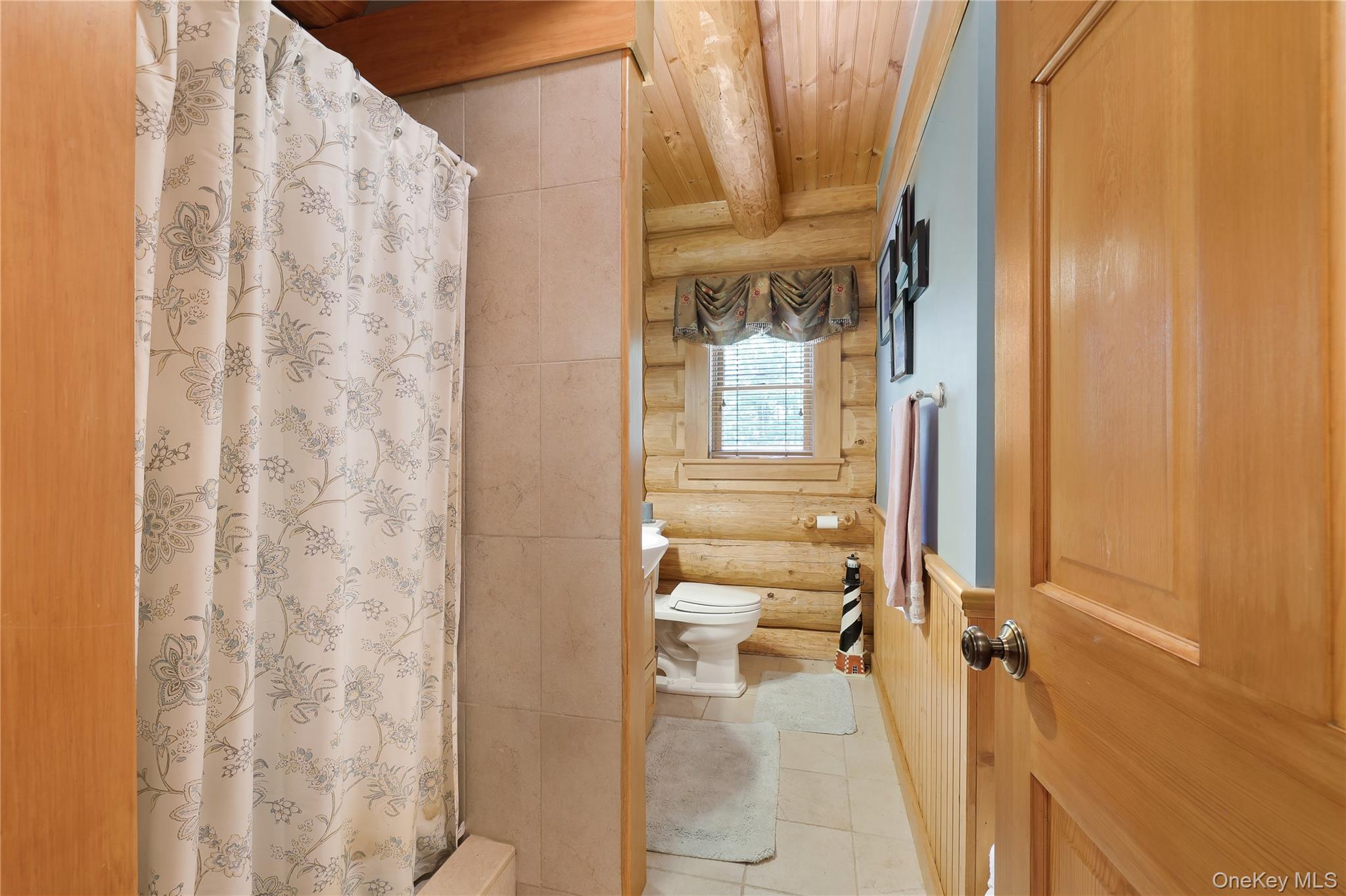 25 Cauthers Road Fallsburg, NY 12789 - Photo 20 of 27 a view of a bathroom with a glass door shower and a sink