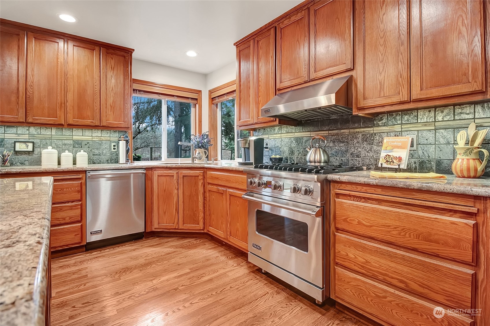 23404 Yeager Road Monroe, WA 98272 - Photo 8 of 40 a kitchen with stainless steel appliances granite countertop wooden cabinets a sink and dishwasher a stove with wooden floor