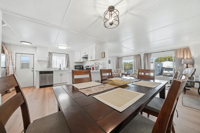 a view of a dining room kitchen and a window