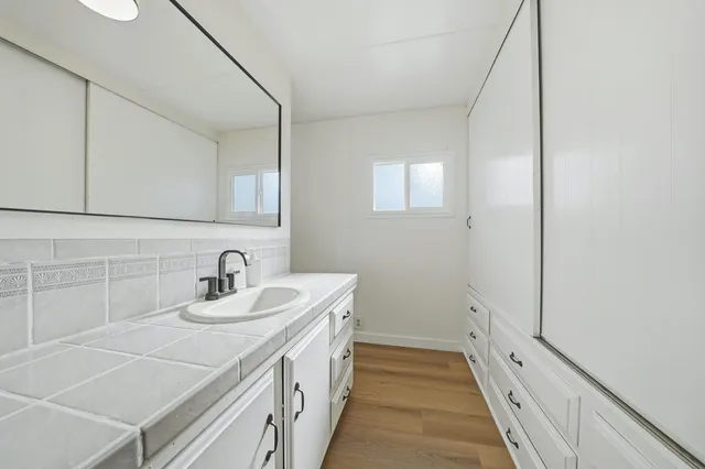 a bathroom with a sink and a mirror