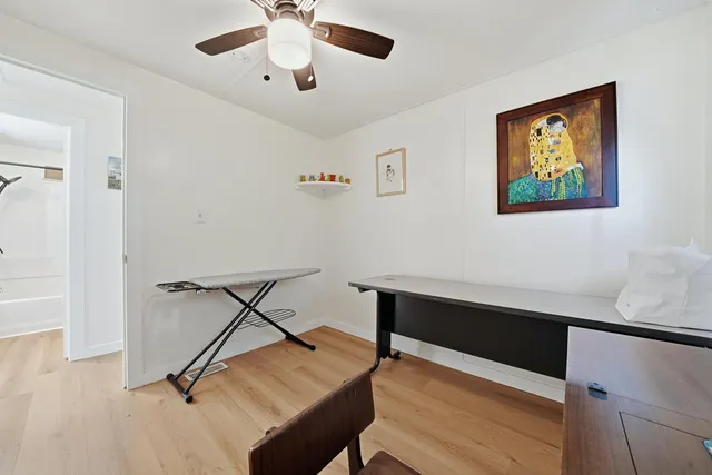 a view of a workspace with furniture