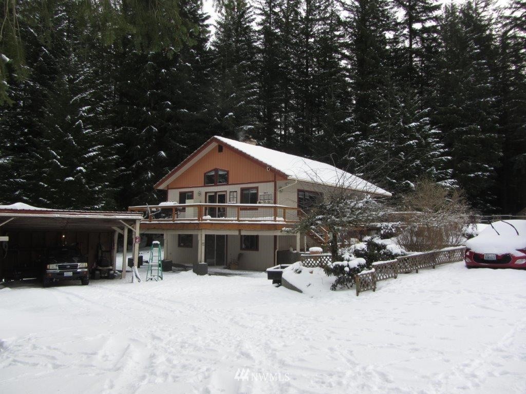 6421 South Pass Road Maple Falls, WA 98266 - Photo 1 of 1 a view of a house with a yard covered with snow in front of house