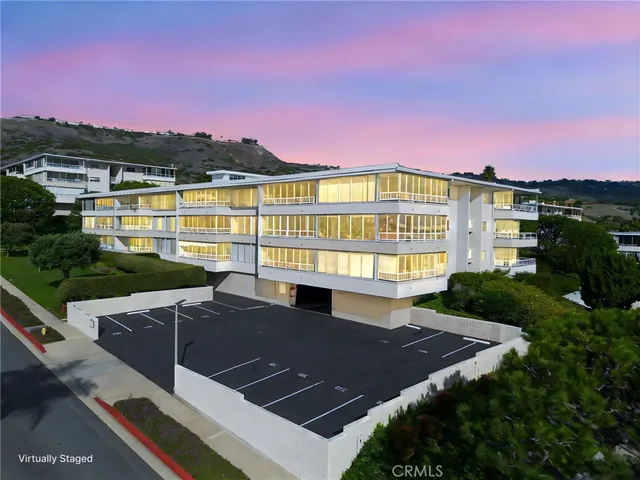 a view of a patio with lawn chairs fire pit and a big yard