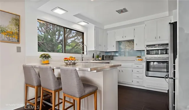 a kitchen with a sink and a window