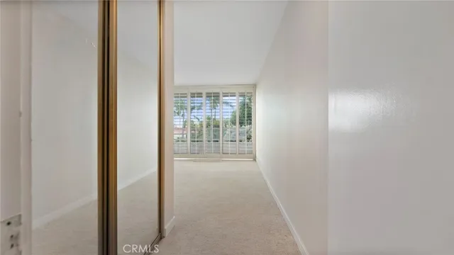a view of a workspace with furniture and a potted plant
