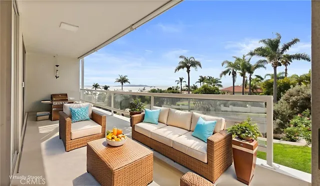 an aerial view of residential houses with outdoor space and ocean view