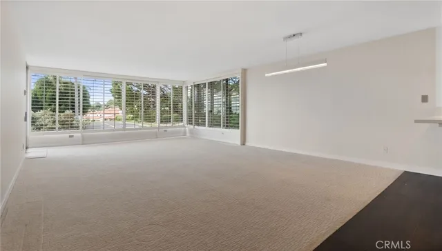 a view of a room with large windows
