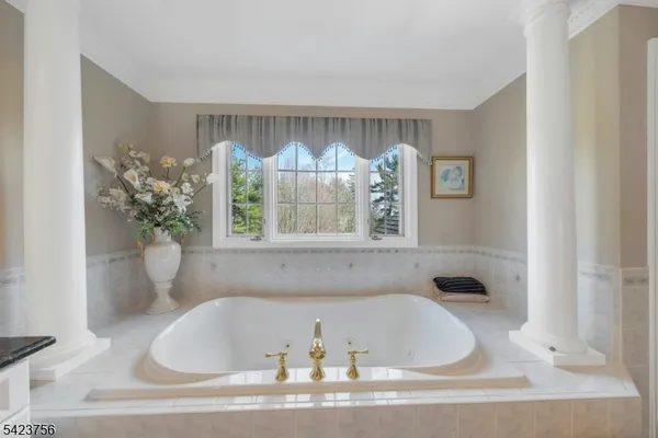 a bathroom with a double vanity sink toilet and a mirror