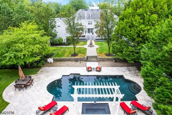 swimming pool view with a seating space