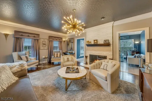 a living room with furniture or couch and a large window