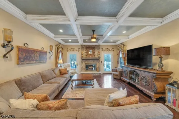 a kitchen with stainless steel appliances granite countertop a sink a stove and a wooden floors