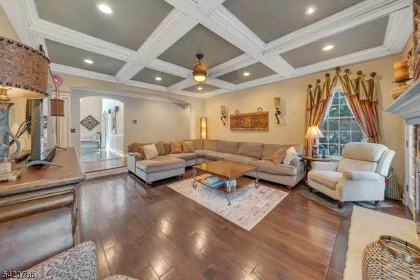 a kitchen with stainless steel appliances kitchen island granite countertop a sink and cabinets