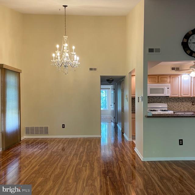 2015 Welsh Road, Unit A24 Philadelphia, PA 19115 - Photo 13 of 29 a view of a kitchen with wooden floor and a kitchen